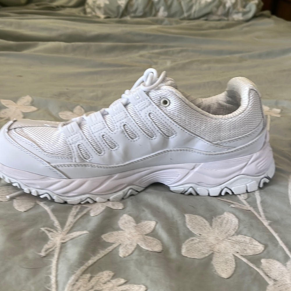 All white Avis shoes